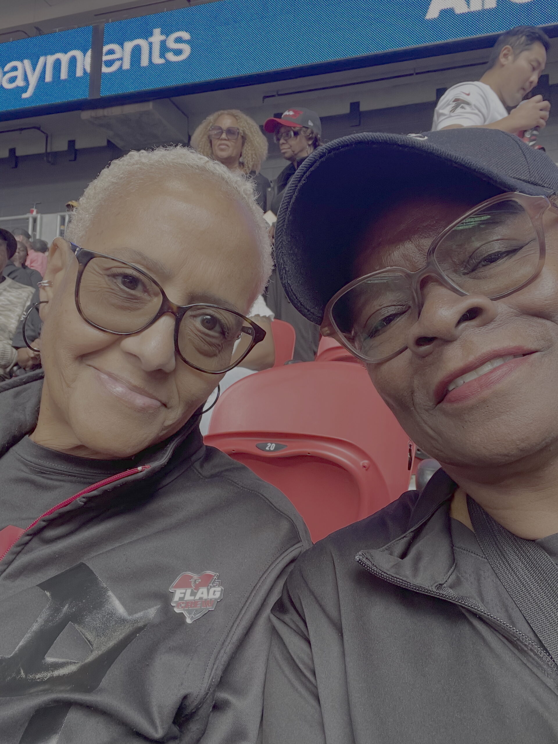 Denita and Stella enjoying an Atlanta Falcons game in 2025. Denita left, Stella right